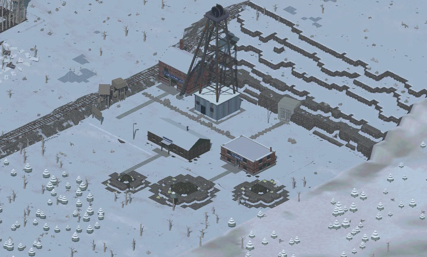 A headframe, rail sidings and spoil heaps in the snow